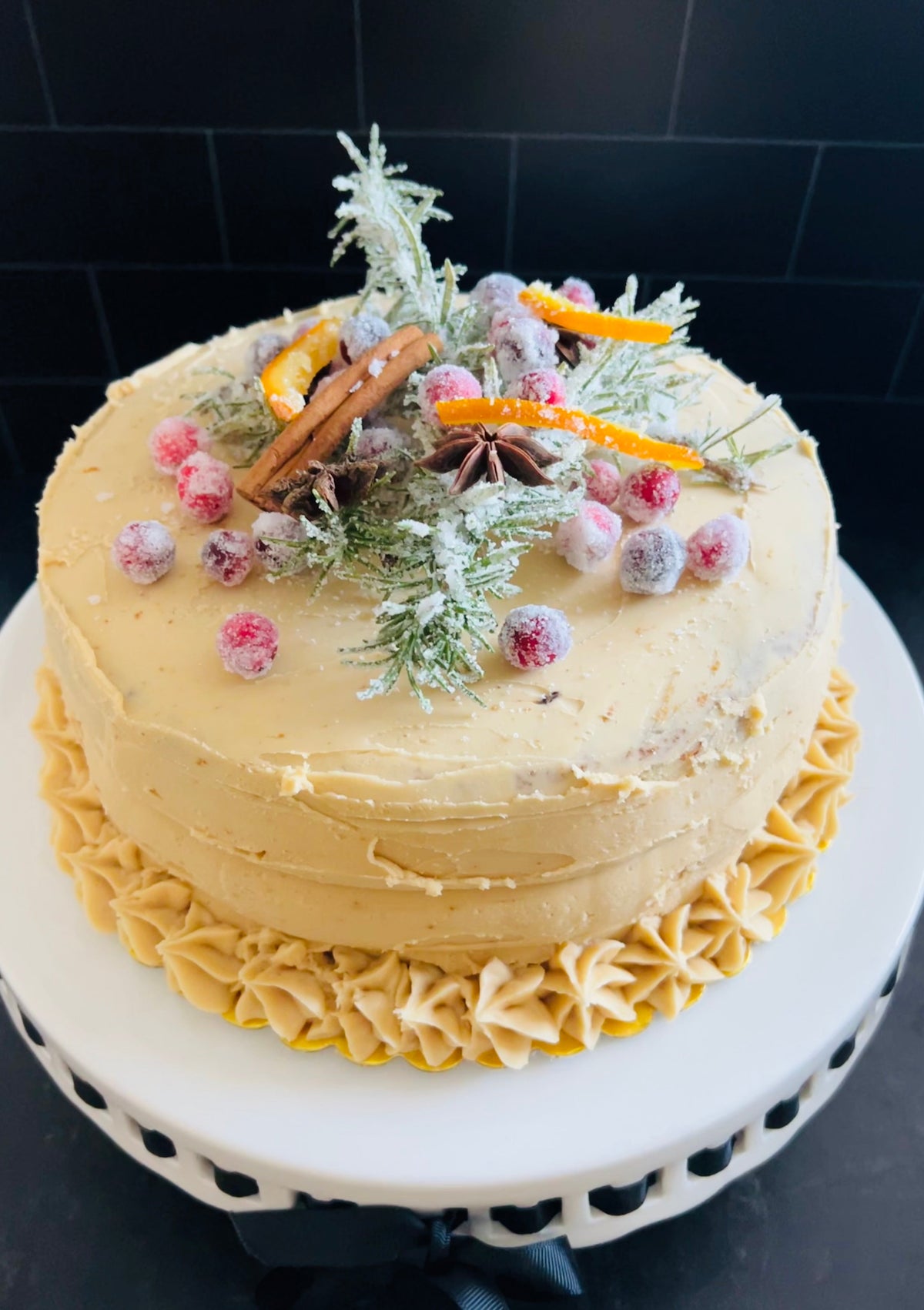 A decorated layer cake made at Little Hidden Bakery in Rancho Santa Fe